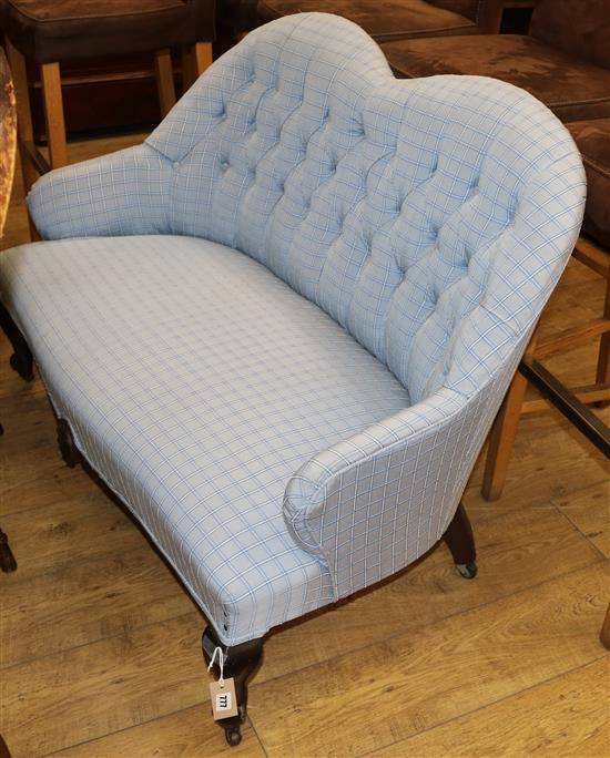 A small blue upholstered button back settee W.120cm